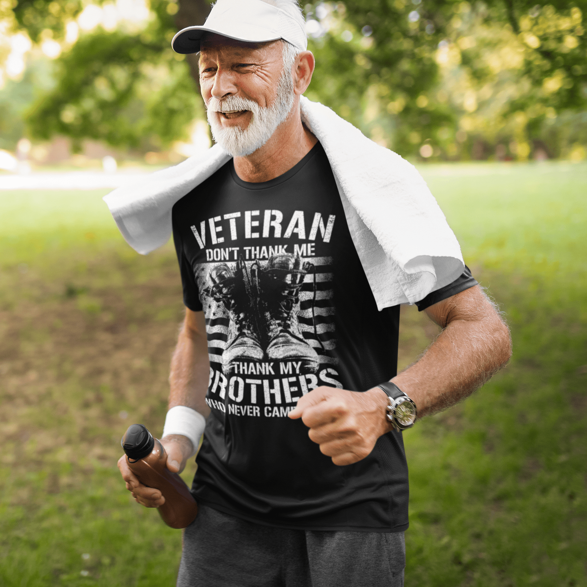 An older man wearing his veterans tshirt with pride saying don’t thank me thank my brothers who never came home.