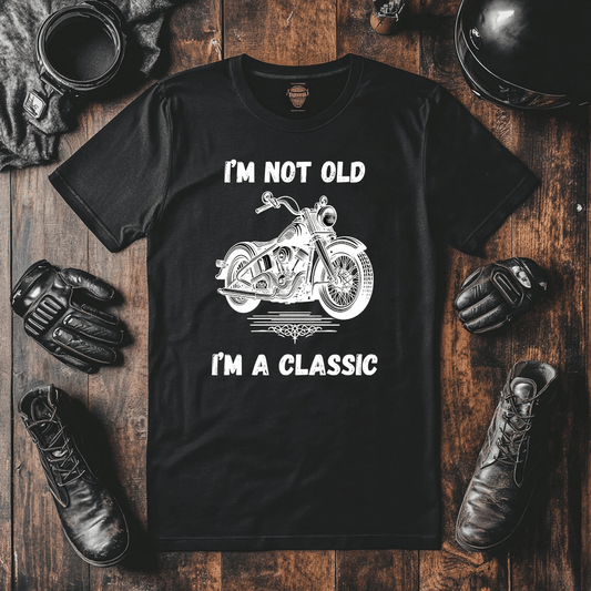 A mock up for a biker tshirt with the quote “I’m Not Old I’m A Classic” with a classic Harley Davidson looking motorcycle in the middle.